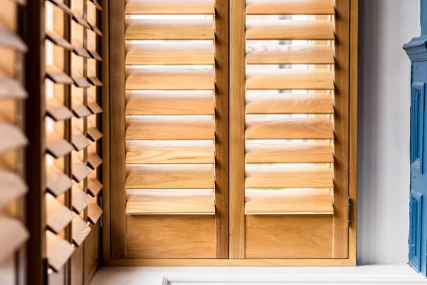 Paulownia plantation shutters bay window detail