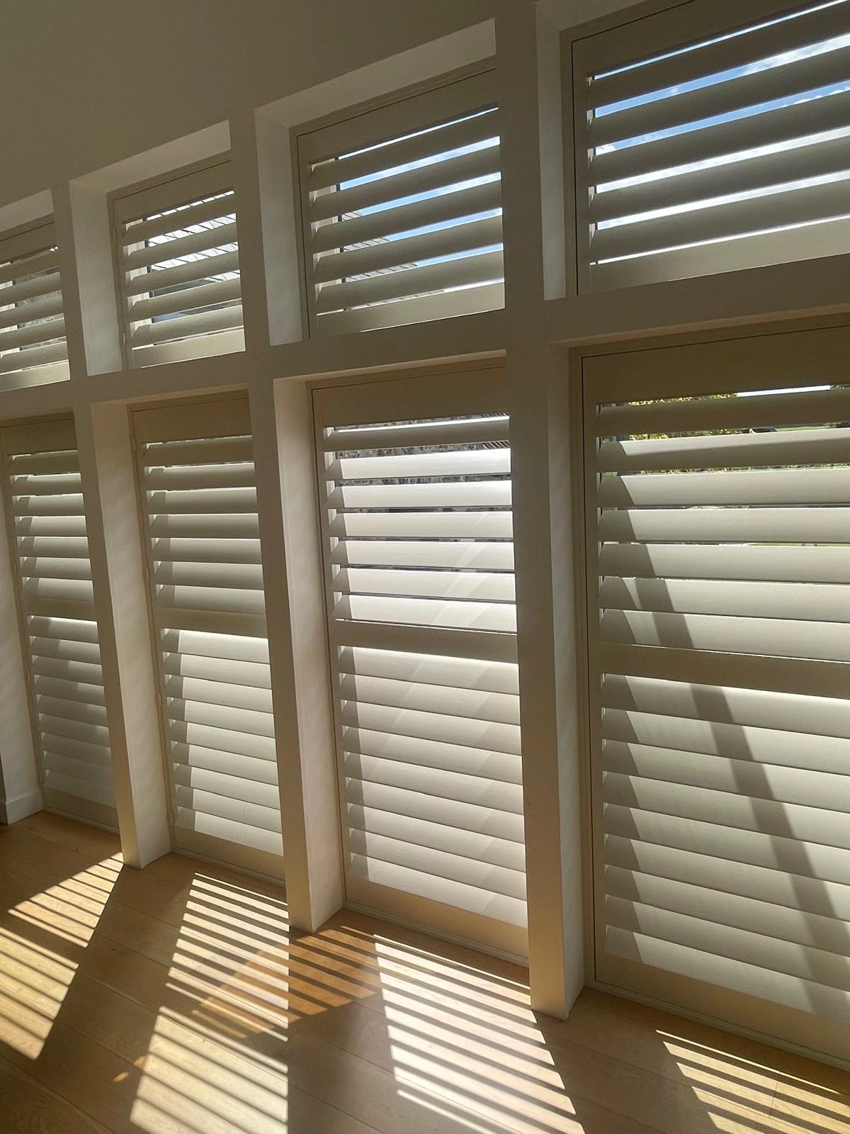 Bifold tracked shutters in a dining room