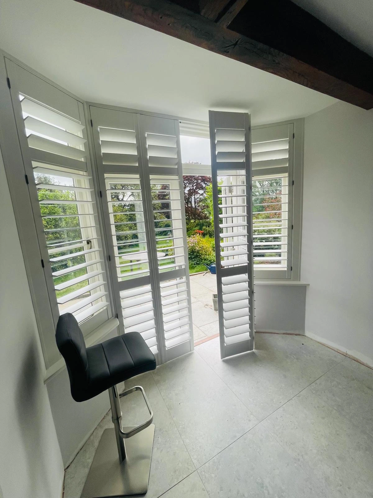 Full height plantation shutters in a living room